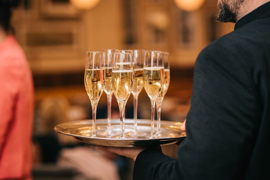 Champagne glasses on a silver tray
